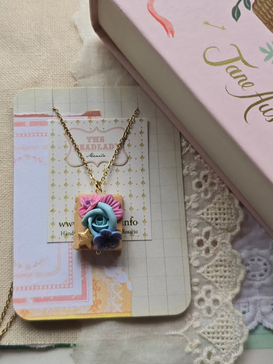 Polymer Clay Book Necklace handmade in the Philippines by Angeli Del Rosario. For the lover of books and stories.